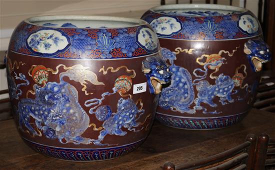 A pair of Fukagawa Imari Hibachi, 38cms (one restored)